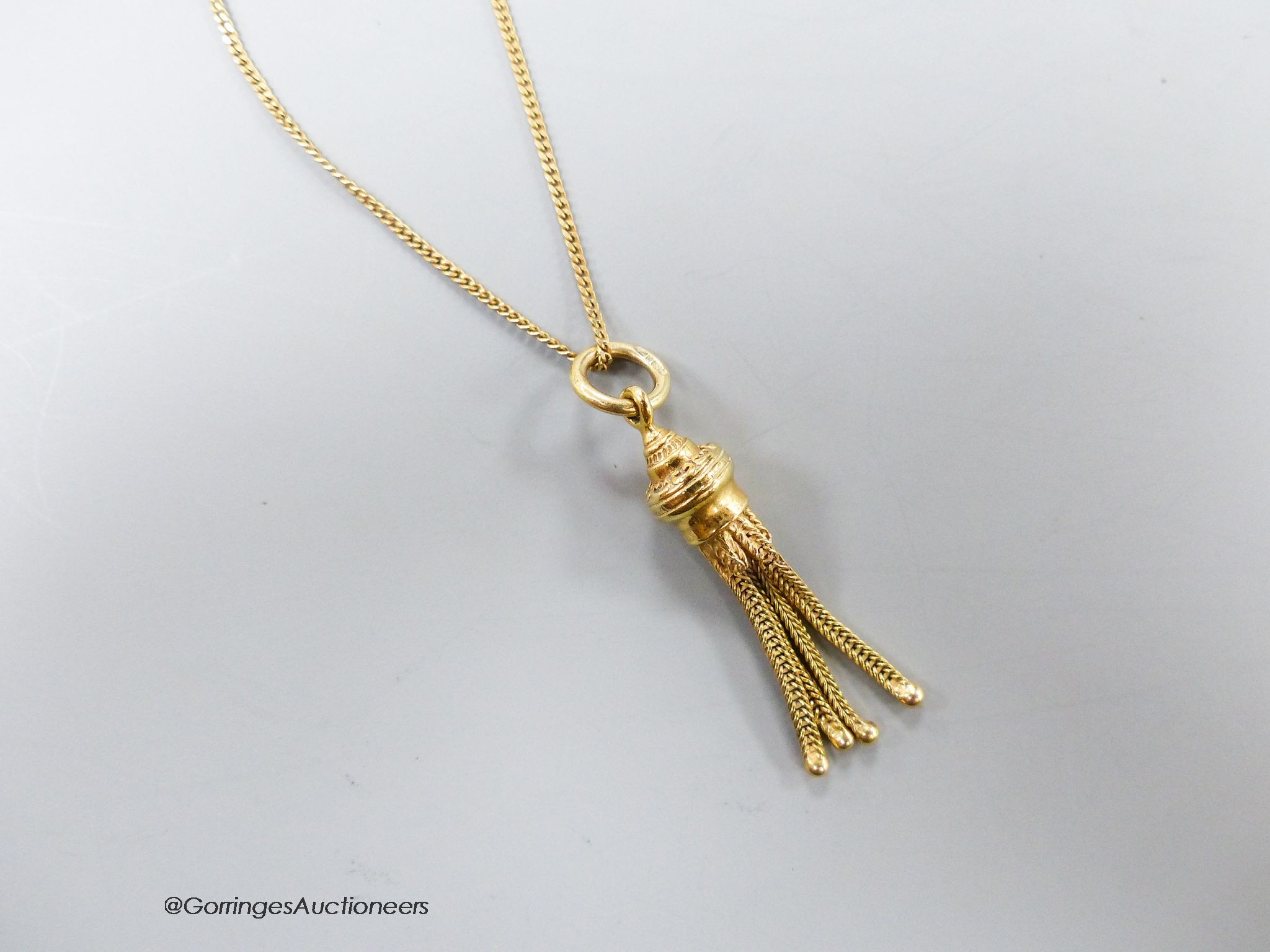 A 9ct gold tassel pendant on 9ct gold fine chain, 5.1 grams.